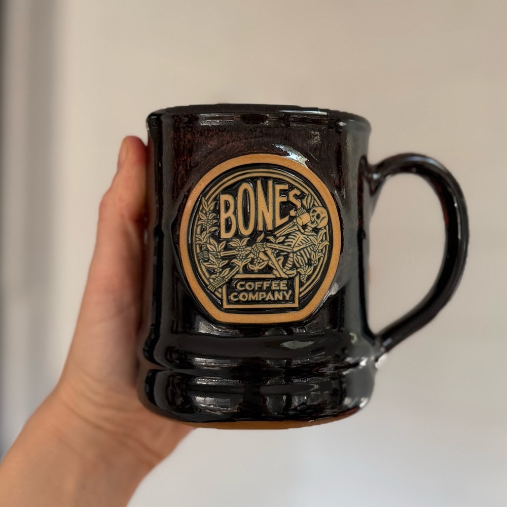 Bones Coffee Company Skeleton drinking coffee dark brown pottery style mug